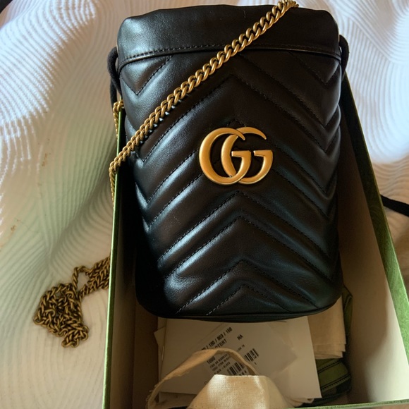 Gucci Handbags - Gucci Marmot Mini Bucket Bag